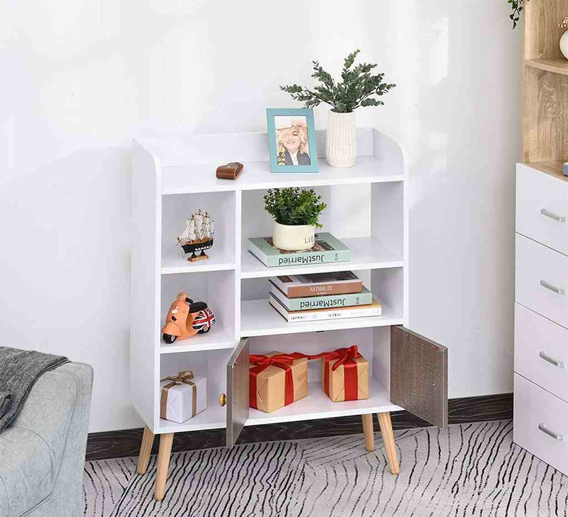 an-open-shelving-unit-and-two-small-doors-furniture-vitrine-furniture-159796.jpg وحده ارفف 90X80 سم - الصورة 1